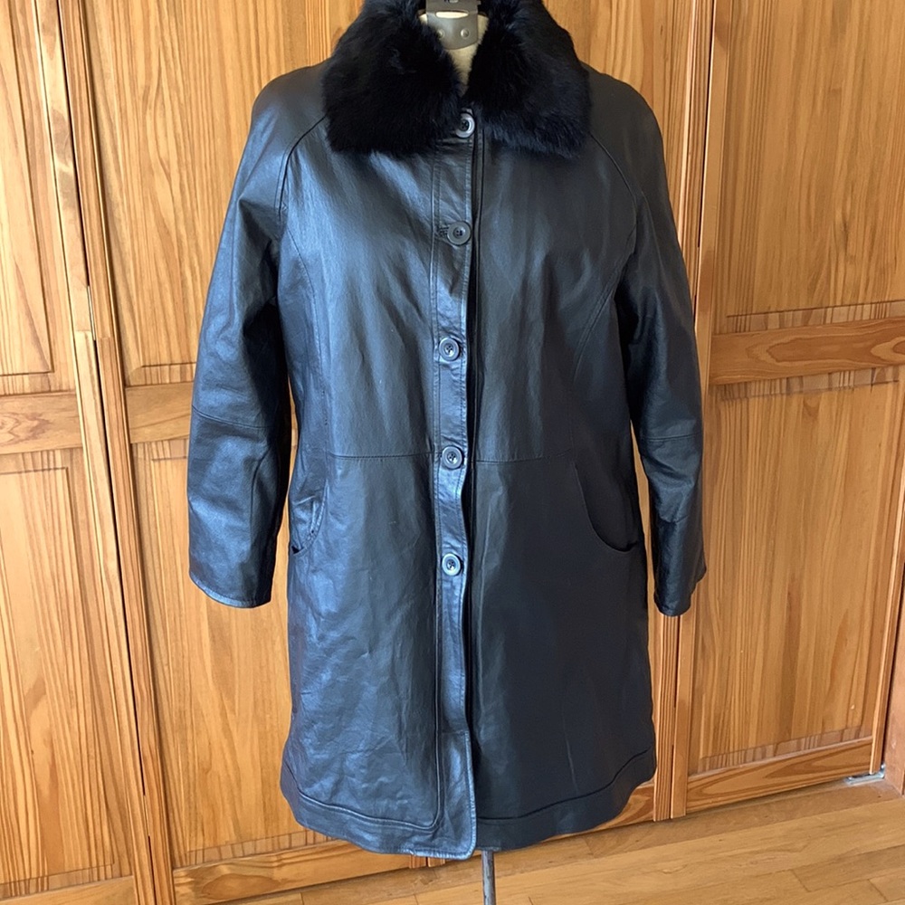 Leather coat with fur trimmed collar